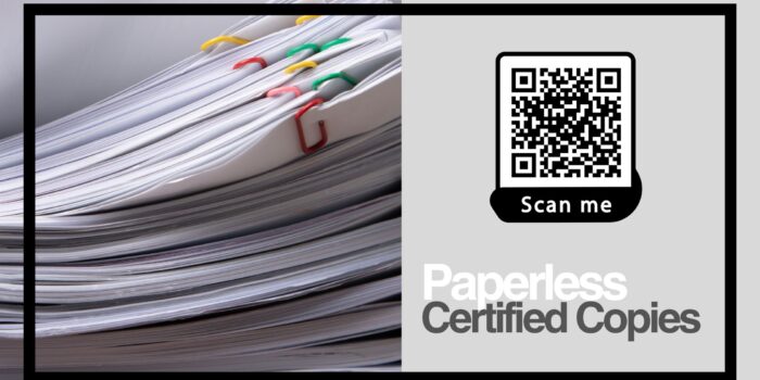 Transition to Paperless Certified Copies with Ease A stack of paper documents bound by colorful paper clips, alongside a QR code promoting the efficiency of paperless certified copies.