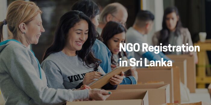 Organized Collaboration for NGO Registration in Sri Lanka n image depicting teamwork and collaboration, as individuals engage in organizing items at a table, symbolizing preparation for an NGO registration process in Sri Lanka.