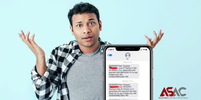 Stay Ahead with Reliable Tax Compliance Reminders A smartphone displaying text message reminders from IRD about tax payment due dates, held by a person in a questioning pose, emphasizing tax compliance and reminders.